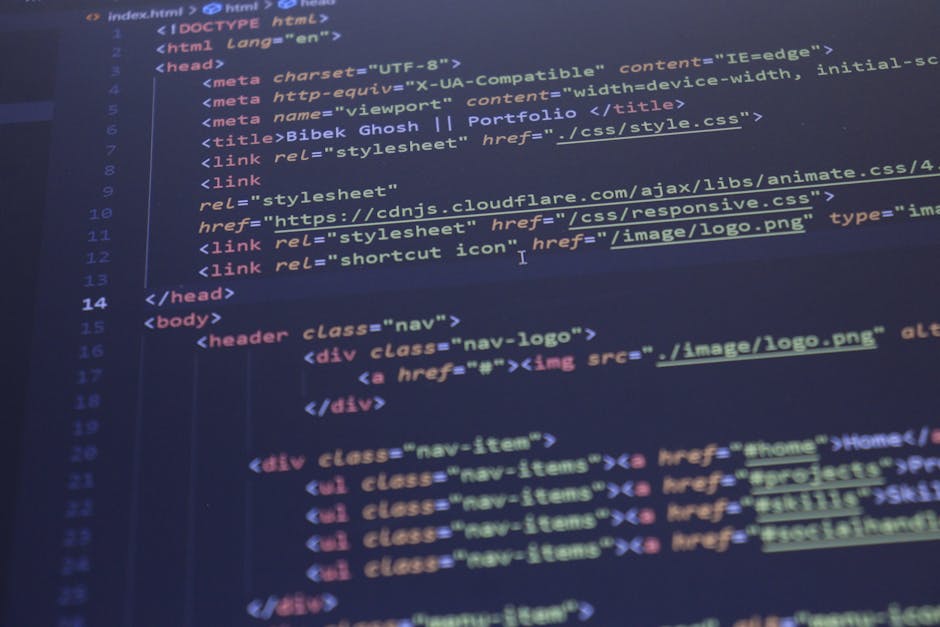 Photograph of a computer screen displaying lines of code with syntax highlighting in multiple colors, including red, green, blue, yellow, and white, on a dark background. The code features various pro